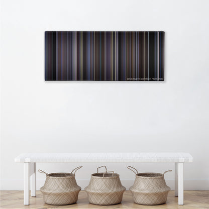 Donnie Darko color palette canvas above a white bench with three woven baskets