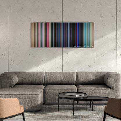 Good Time color palette canvas on a concrete wall above a gray sectional sofa