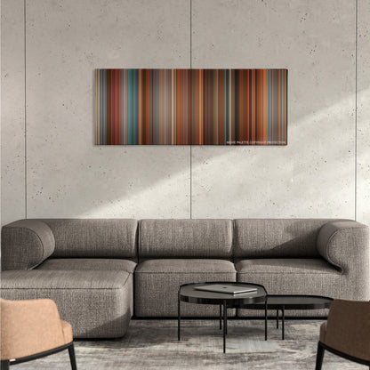 The Ugly Truth color palette canvas on a concrete wall above a gray sectional sofa