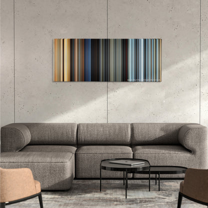 The Fate of the Furious color palette canvas on a concrete wall above a gray sectional sofa