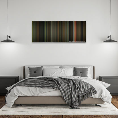 Moon color palette canvas above a bed, between two black pendant lamps
