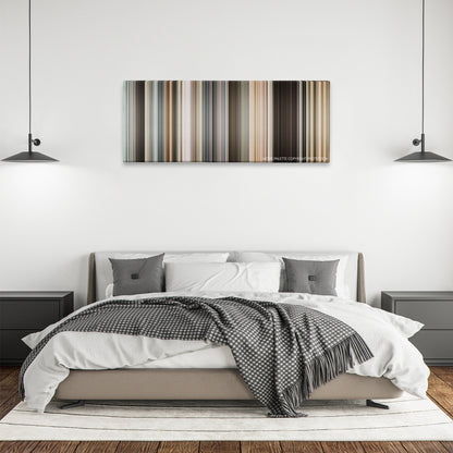 The International color palette canvas above a bed, between two black pendant lamps