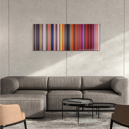 Cloudy with a Chance of Meatballs color palette canvas on a concrete wall above a gray sectional sofa