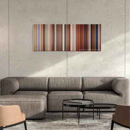 Intolerable Cruelty color palette canvas on a concrete wall above a gray sectional sofa