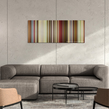 That's My Boy color palette canvas on a concrete wall above a gray sectional sofa
