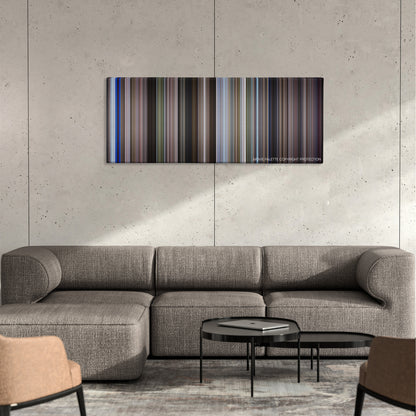 Moonraker color palette canvas on a concrete wall above a gray sectional sofa