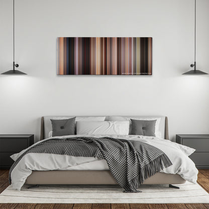 Jackie Brown color palette canvas above a bed, between two black pendant lamps