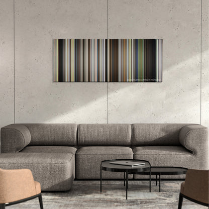 Take Shelter color palette canvas on a concrete wall above a gray sectional sofa