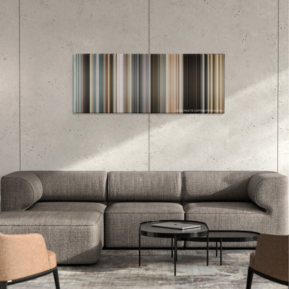 The International color palette canvas on a concrete wall above a gray sectional sofa