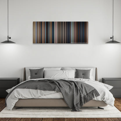 Jack Reacher color palette canvas above a bed, between two black pendant lamps