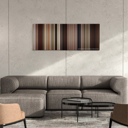 DragonHeart color palette canvas on a concrete wall above a gray sectional sofa