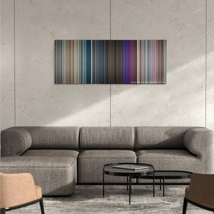 Closer color palette canvas on a concrete wall above a gray sectional sofa