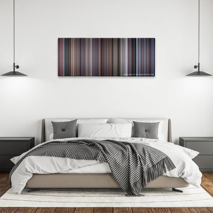 WarGames color palette canvas above a bed, between two black pendant lamps