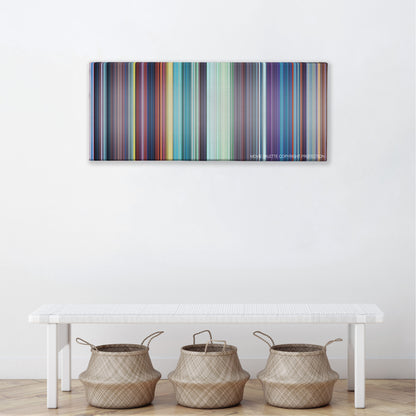 The Sword in the Stone color palette canvas above a white bench with three woven baskets