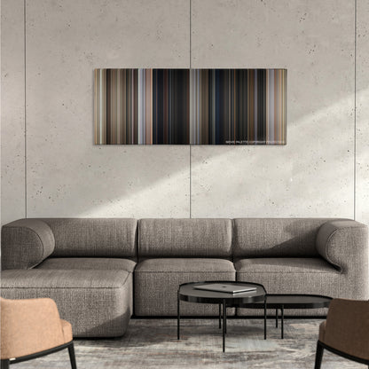 A Fistful of Dollars color palette canvas on a concrete wall above a gray sectional sofa