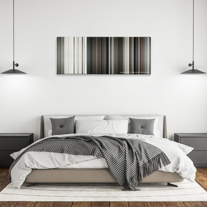 Funny Games color palette canvas above a bed, between two black pendant lamps