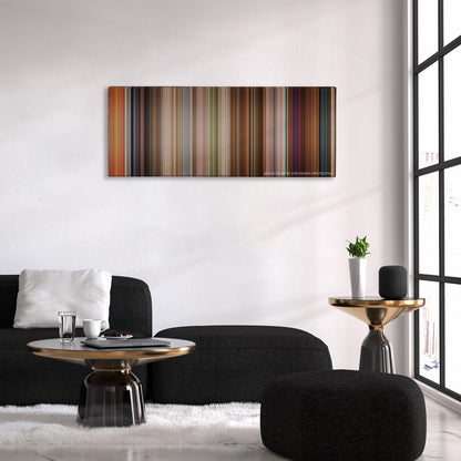 Enchanted color palette canvas above a black sofa with a gold-topped table