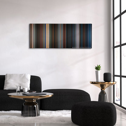 Mr. & Mrs. Smith color palette canvas above a black sofa with a gold-topped table