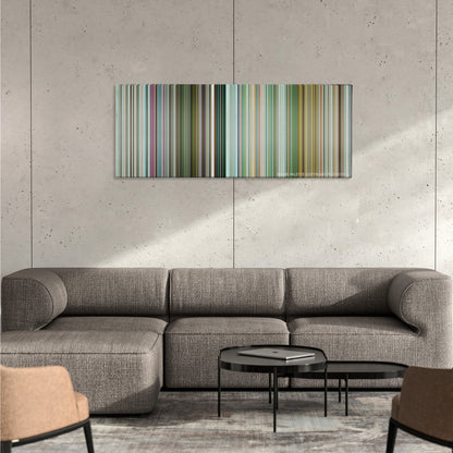 Pain & Gain color palette canvas on a concrete wall above a gray sectional sofa