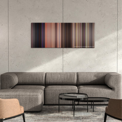 Broken Arrow color palette canvas on a concrete wall above a gray sectional sofa