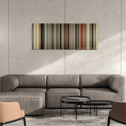 Malena color palette canvas on a concrete wall above a gray sectional sofa