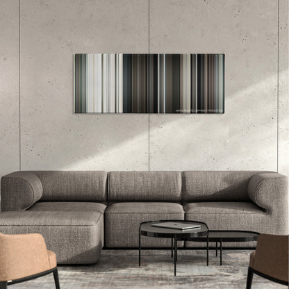 Funny Games color palette canvas on a concrete wall above a gray sectional sofa