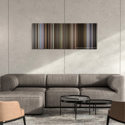 Self/less color palette canvas on a concrete wall above a gray sectional sofa