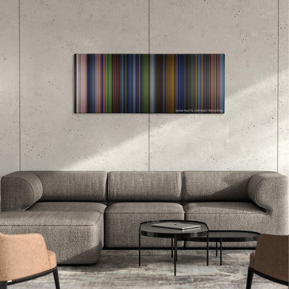 Saw: The Final Chapter color palette canvas on a concrete wall above a gray sectional sofa