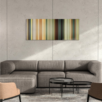 The Impossible color palette canvas on a concrete wall above a gray sectional sofa