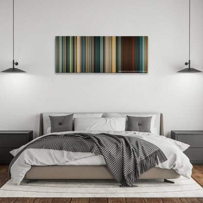 Seven Pounds color palette canvas above a bed, between two black pendant lamps