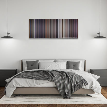 Con Air color palette canvas above a bed, between two black pendant lamps
