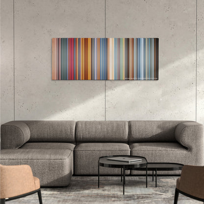 Austin Powers in Goldmember color palette canvas on a concrete wall above a gray sectional sofa