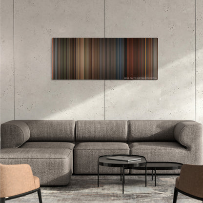 A Series of Unfortunate Events color palette canvas on a concrete wall above a gray sectional sofa