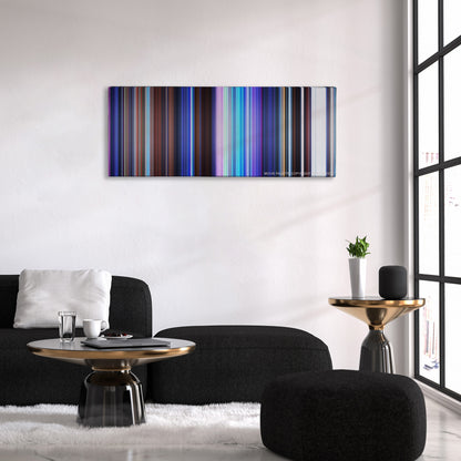 Frozen color palette canvas above a black sofa with a gold-topped table