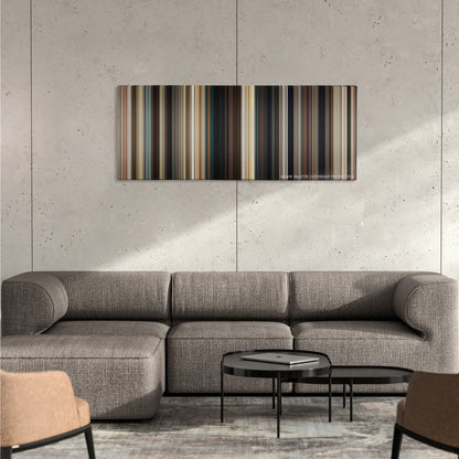 2 Guns color palette canvas on a concrete wall above a gray sectional sofa