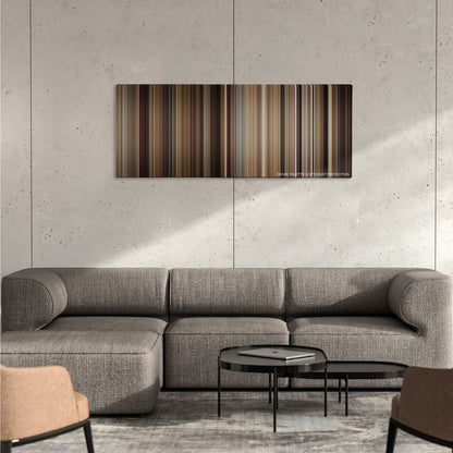 Chef color palette canvas on a concrete wall above a gray sectional sofa