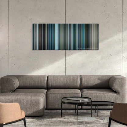 The Bourne Legacy color palette canvas on a concrete wall above a gray sectional sofa