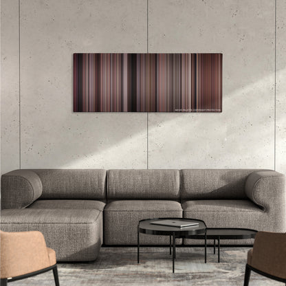 Rocky II color palette canvas on a concrete wall above a gray sectional sofa