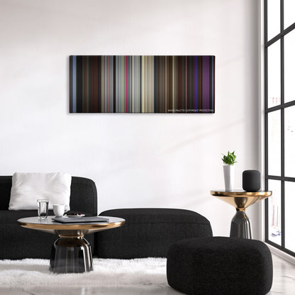 The King of Comedy color palette canvas above a black sofa with a gold-topped table