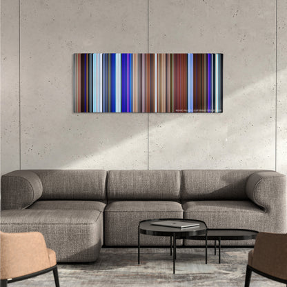 Soul color palette canvas on a concrete wall above a gray sectional sofa