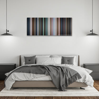 Shazam! color palette canvas above a bed, between two black pendant lamps