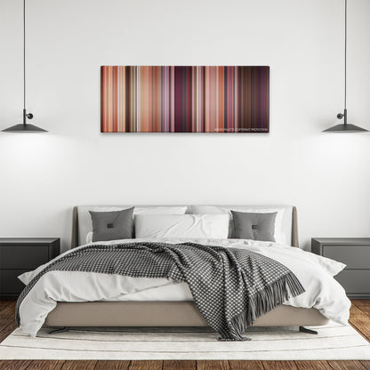 The Hot Chick color palette canvas above a bed, between two black pendant lamps