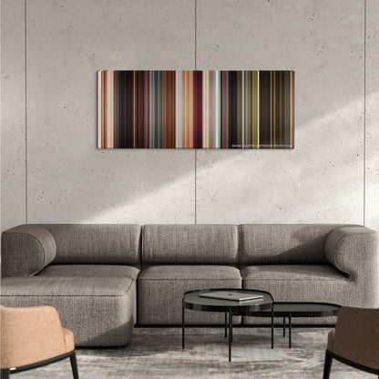 The Croods color palette canvas on a concrete wall above a gray sectional sofa