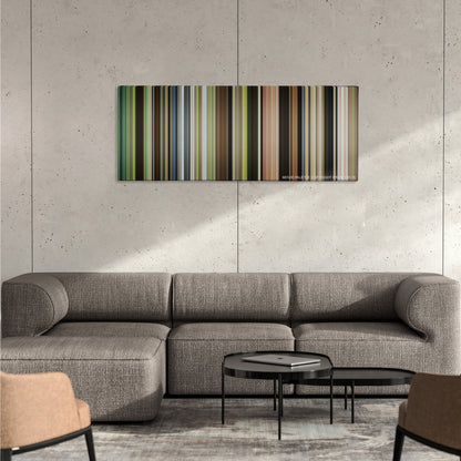 Captain Fantastic color palette canvas on a concrete wall above a gray sectional sofa