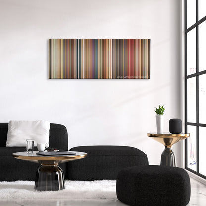 Bedtime Stories color palette canvas above a black sofa with a gold-topped table