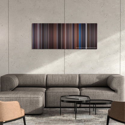 Scrooged color palette canvas on a concrete wall above a gray sectional sofa