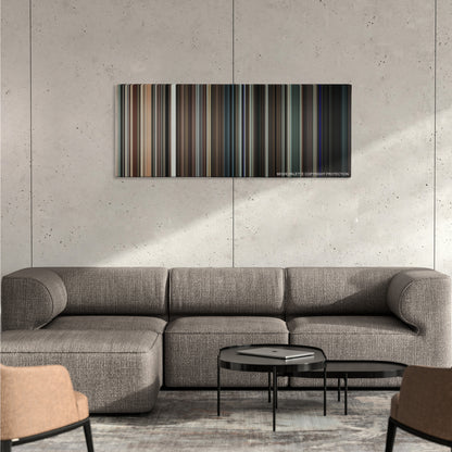 Orphan color palette canvas on a concrete wall above a gray sectional sofa