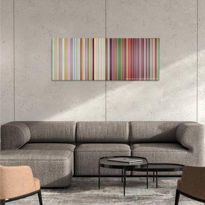 South Park: Bigger, Longer & Uncut color palette canvas on a concrete wall above a gray sectional sofa