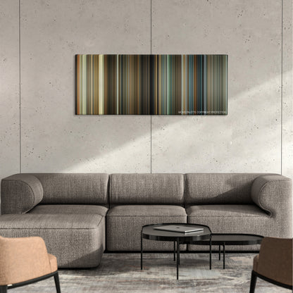 The Box color palette canvas on a concrete wall above a gray sectional sofa