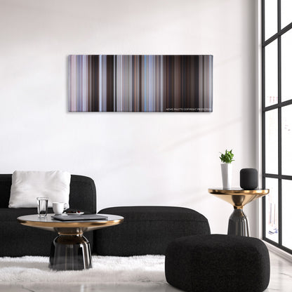 The Magnificent Seven color palette canvas above a black sofa with a gold-topped table
